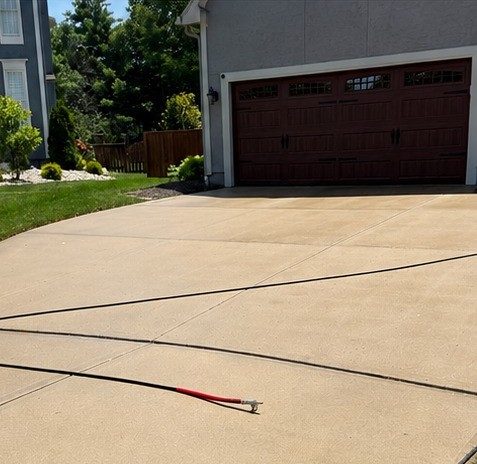 Same driveway restored to like-new condition after Elite Pressure Pros cleaning